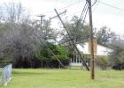 High winds knock over poles, knock out service to homes
